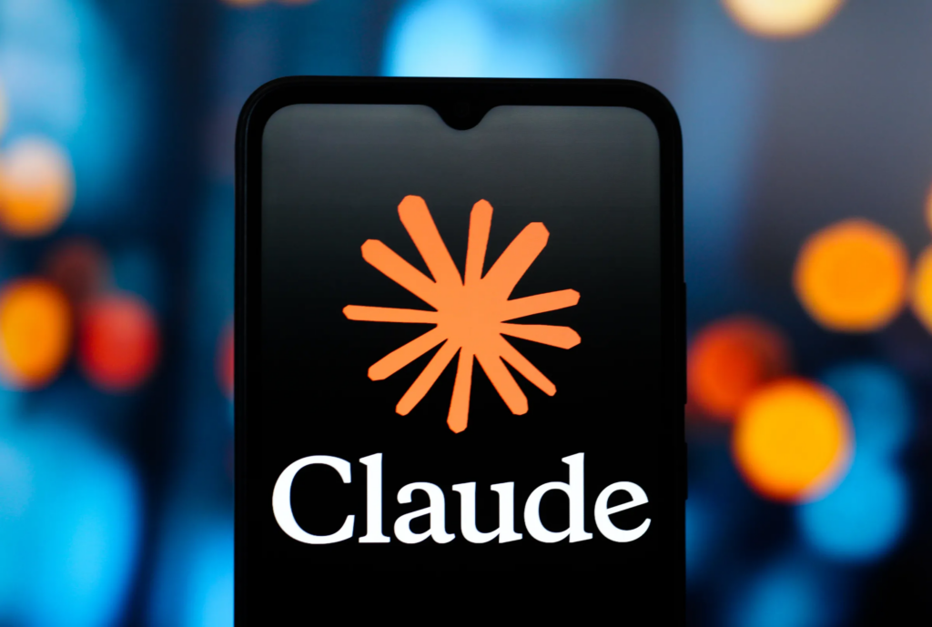 Claude AI logo displayed on a smartphone screen with a blurred background, representing the AI chatbot in 2026(ChatGPT vs Gemini vs Claude)